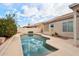 Inviting backyard pool with ample patio space for relaxation at 7138 E Laguna Azul Ave, Mesa, AZ 85209