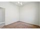 Simple bedroom with ceiling fan and carpeted floors at 7138 E Laguna Azul Ave, Mesa, AZ 85209