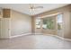 Spacious bedroom featuring a large window and ceiling fan at 7138 E Laguna Azul Ave, Mesa, AZ 85209