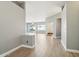 Bright entryway with wood-look floors and views to the living room at 7138 E Laguna Azul Ave, Mesa, AZ 85209