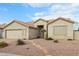 One-story home with a two-car garage and a landscaped front yard at 7138 E Laguna Azul Ave, Mesa, AZ 85209