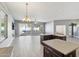 Open living room with kitchen island and sliding glass doors at 7138 E Laguna Azul Ave, Mesa, AZ 85209