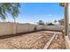 Landscaped backyard with patio and partial view of the house at 7419 S 31St Dr, Phoenix, AZ 85041