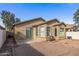 Landscaped backyard with patio and partial view of the house at 7419 S 31St Dr, Phoenix, AZ 85041