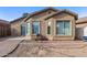 Landscaped backyard with patio and partial view of the house at 7419 S 31St Dr, Phoenix, AZ 85041