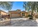 Attractive house exterior with a two-car garage and well-maintained landscaping at 7419 S 31St Dr, Phoenix, AZ 85041