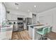 Modern kitchen with stainless steel appliances and an island at 7419 S 31St Dr, Phoenix, AZ 85041