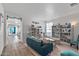 Living room with teal couch, built-in shelving, and a coffee table at 7419 S 31St Dr, Phoenix, AZ 85041