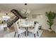 Open dining area with a round table and four chairs, showcasing a contemporary design at 8413 N 55Th Ave, Glendale, AZ 85302