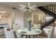 Modern dining area featuring a round table, four chairs, and a stylish light fixture at 8413 N 55Th Ave, Glendale, AZ 85302