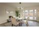 Dining area with white table, four chairs, and access to patio at 8413 N 55Th Ave, Glendale, AZ 85302