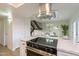 Modern kitchen with stainless steel appliances and a breakfast bar at 8413 N 55Th Ave, Glendale, AZ 85302