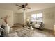 Living room with gray sofa, gold accents, and large window at 8413 N 55Th Ave, Glendale, AZ 85302