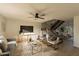 Living room with gray sofa, gold accents, and a staircase at 8413 N 55Th Ave, Glendale, AZ 85302