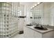 Bathroom with double vanity, large mirror, and a glass block shower at 9020 N Flying Butte --, Fountain Hills, AZ 85268