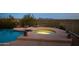 Relaxing pool and spa with mountain views at dusk at 9020 N Flying Butte --, Fountain Hills, AZ 85268