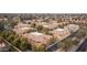 Aerial view of community with numerous townhouses, lush landscaping, and a pool at 955 E Knox Rd # 110, Chandler, AZ 85225