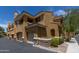 Building exterior showcasing Spanish-style architecture and garages at 955 E Knox Rd # 110, Chandler, AZ 85225