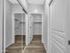 Hallway with mirrored closet doors and wood flooring at 955 E Knox Rd # 110, Chandler, AZ 85225