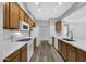 Modern kitchen with white countertops and wood cabinets at 955 E Knox Rd # 110, Chandler, AZ 85225