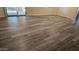 Living room with wood-look floors and access to patio at 955 E Knox Rd # 110, Chandler, AZ 85225