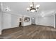 Bright living room with hardwood floors and chandelier at 955 E Knox Rd # 110, Chandler, AZ 85225