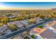 Aerial view of a residential street with houses and landscaping at 9690 N 117Th Way, Scottsdale, AZ 85259