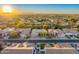 Aerial view of neighborhood with houses and mountain backdrop at 9690 N 117Th Way, Scottsdale, AZ 85259