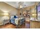 Bright bedroom with a brass bed frame and wood floors at 9690 N 117Th Way, Scottsdale, AZ 85259