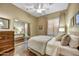 Guest bedroom with mirrored closet doors and wood floors at 9690 N 117Th Way, Scottsdale, AZ 85259