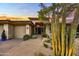 Front entrance to a lovely home with a large, mature cactus plant at 9690 N 117Th Way, Scottsdale, AZ 85259