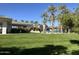 Grass and palm trees near clubhouse and pool area at 9690 N 117Th Way, Scottsdale, AZ 85259