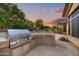 Built-in outdoor kitchen with a grill and stone countertops at 9690 N 117Th Way, Scottsdale, AZ 85259