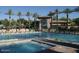 Resort-style pool with spa and clubhouse in background at 9690 N 117Th Way, Scottsdale, AZ 85259