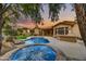 Relaxing pool and spa area with a covered patio and outdoor kitchen at 9690 N 117Th Way, Scottsdale, AZ 85259