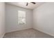 Bright bedroom with window blinds and neutral wall color at 10031 E Gamma Ave, Mesa, AZ 85212