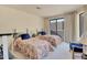 Bedroom with two twin beds, a sitting area, and access to a private balcony at 10040 E Happy Valley Rd # 1047, Scottsdale, AZ 85255