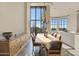 Elegant dining room with large windows and a beautiful chandelier at 10040 E Happy Valley Rd # 1047, Scottsdale, AZ 85255