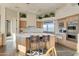 Large kitchen with ample cabinetry and island seating at 10040 E Happy Valley Rd # 1047, Scottsdale, AZ 85255