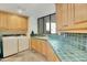 Bright laundry room with washer, dryer, and ample cabinetry at 10040 E Happy Valley Rd # 1047, Scottsdale, AZ 85255