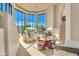 Spacious living room with floor-to-ceiling windows and fireplace at 10040 E Happy Valley Rd # 1047, Scottsdale, AZ 85255