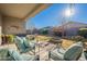 Spacious backyard with grassy area, fire pit, and mature trees at 10421 E Cliffrose Ln, Florence, AZ 85132