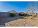 Large backyard with gravel landscaping and a stone pathway at 10421 E Cliffrose Ln, Florence, AZ 85132