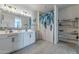 Double vanity bathroom with a walk-in shower at 10421 E Cliffrose Ln, Florence, AZ 85132