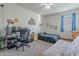 Bedroom with desk setup, bed, and futon at 10421 E Cliffrose Ln, Florence, AZ 85132