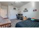 Bedroom with desk setup, bed, and futon at 10421 E Cliffrose Ln, Florence, AZ 85132