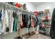 Large walk-in closet with ample hanging space and shelving at 10421 E Cliffrose Ln, Florence, AZ 85132