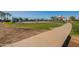Walking path near community tennis courts and playground at 10421 E Cliffrose Ln, Florence, AZ 85132