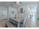Farmhouse-style dining room with a view into the kitchen at 10421 E Cliffrose Ln, Florence, AZ 85132