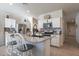 Modern kitchen with white cabinets and granite countertops at 10421 E Cliffrose Ln, Florence, AZ 85132